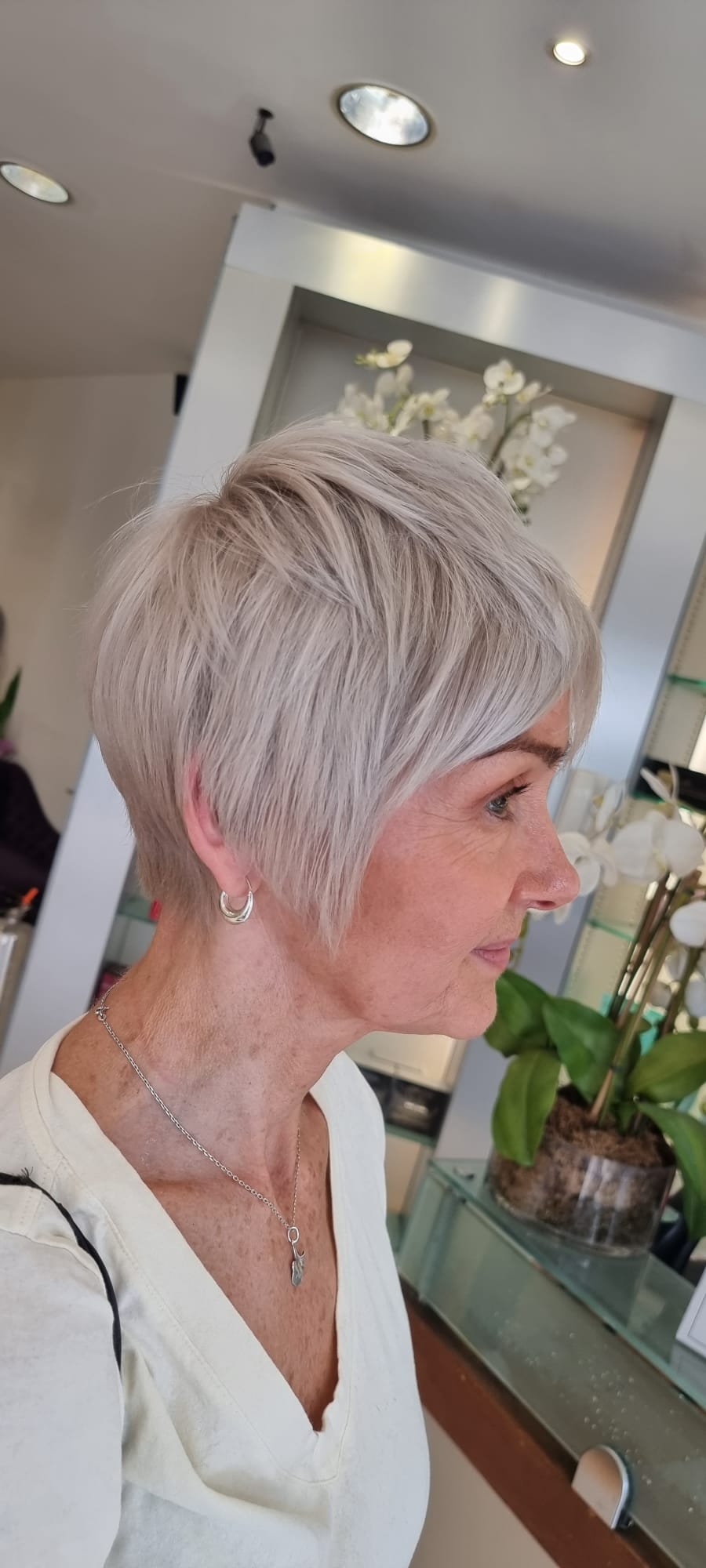 A colour coordinated ash blonde pixie ‘do.