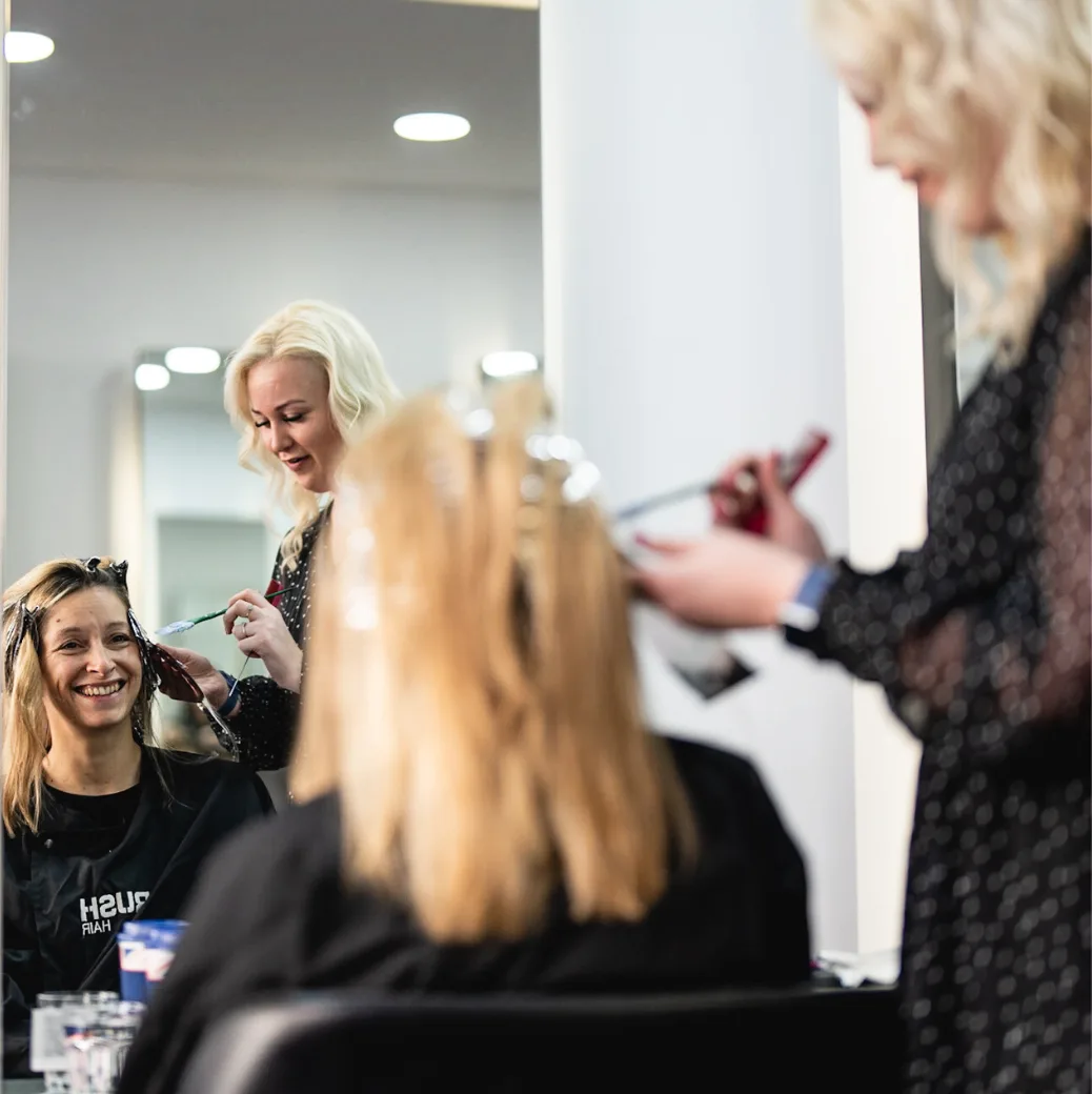 Lady having her hair coloured in salon by a Rush stylist