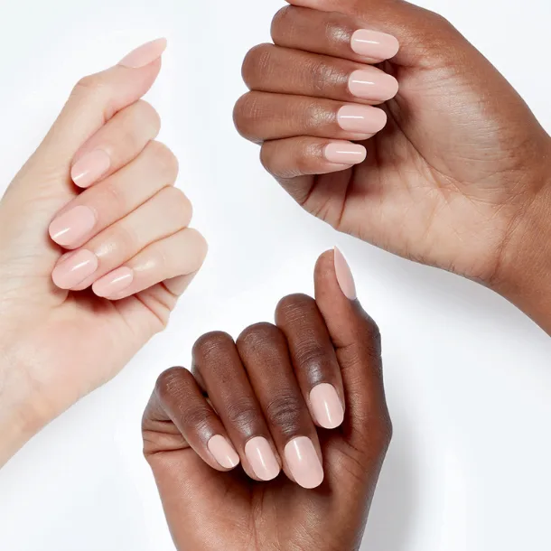 Three customers hands on a white background with a smooth coral nail polish